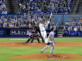 The Los Angeles Dodgers and San Francisco Giants play before a crowd of cardboard cutouts as the Major League Baseball season opened on July 23, 2020, after being postponed since March due to the COVID-19 pandemic.