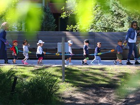 Daycare kids enjoy a morning walk through Eau Claire on Monday, July 6, 2020.