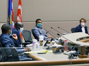 From left; Nyall DaBreo, Francis Boakye, councillor George Chahal and councillor and committee chair Gian-Carlo Carra take part in a Calgary City Council anti-racism hearing on Tuesday, July 7, 2020.