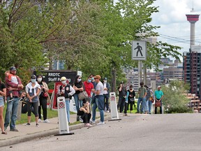 Calgarians line up for walk-in COVID-19 testing at the Richmond Road Diagnostic and Treatment Centre on Thursday, July 9, 2020.