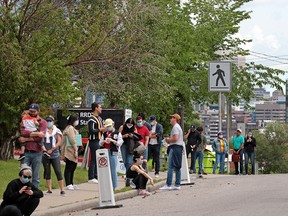 Calgarians line up for walk-in COVID-19 testing at the Richmond Road Diagnostic and Treatment Centre on Thursday, July 9, 2020.  Gavin Young/Postmedia