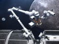 An artist's concept of Canadarm3 on the Lunar Gateway orbiting the moon.