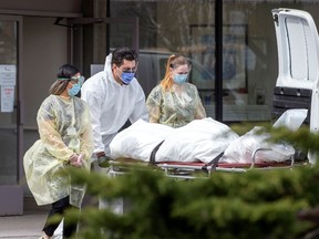 A body is removed after several residents died of the coronavirus disease (COVID-19) at the Eatonville Care Centre in Toronto, Ontario, Canada April 14, 2020.
