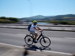 Cycling continues to grow in popularity, as does the need for safer roadways for cyclists. Calgary Herald wire photo.