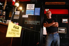Landlord Johnny McFadden, 61, poses for a photo at the bar area of The Star Inn, where an electric fence has been installed at the bar area to ensure customers are socially distanced from staff while ordering drinks, following the outbreak of the coronavirus disease (COVID-19), in in St Just, Cornwall, Britain July 14, 2020.