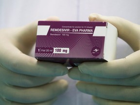 A lab technicians holds the coronavirus disease (COVID-19) treatment drug "Remdesivir" at Eva Pharma Facility in Cairo, Egypt June 25, 2020.