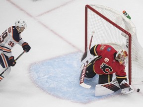 Calgary Flames goalie Cam Talbot stops the Edmonton Oilers' Alex Chiasson during an NHL exhibition game at Rogers Place in Edmonton on Tuesday, July 28, 2020. Jason Franson/The Canadian Press