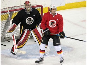 Calgary Flames goaltender Jon Gillies and forward Sean Monahan take part in the teamÕs first practice since the COVID-19 shutdown at the Scotiabank Saddledome in Calgary on Monday, July 13, 2020.  Gavin Young/Postmedia