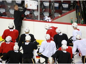 Calgary Flames head coach Geoff Ward talks with players as the team held their first practice since the COVID-19 shutdown at the Scotiabank Saddledome in Calgary on Monday, July 13, 2020.  Gavin Young/Postmedia