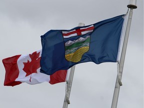 The flags of Alberta and Canada.