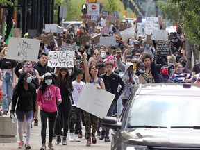 Thousands of protesters march in Calgary in support of Juneteenth and Black Lives Matter on June 19, 2020. The crowd ended up outside Calgary city hall.