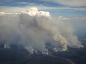Wildfires burning in and around Fort McMurray on May 4, 2016. Four years after its flames guttered out, the Fort McMurray wildfire is still affecting the massive river system that flowed through it.