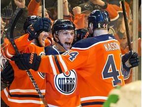 The Edmonton Oilers' Matt Benning (83) celebrates his goal against the Calgary Flames, with Connor McDavid (97) and Zack Kassian (44) during third period NHL action at Rogers Place, in Edmonton Wednesday Jan. 29, 2020. Photo by David Bloom