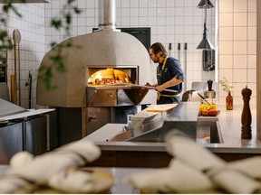 A large forno oven takes centrestage in the new Farm & Fire restaurant in Banff's Elk + Avenue Hotel. Courtesy Pursuit