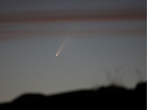 The Comet C/2020 or "Neowise", is seen in the sky over Ballintoy, Britain July 8, 2020.