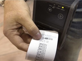 FILE - A 50/50 ticket is printed off prior to the start of the Edmonton Oilers and Calgary Flames NHL pre-season action at Rexall Place, in Edmonton Alta. on Monday Sept. 21, 2015.