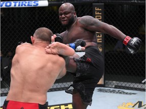 LAS VEGAS, NEVADA - AUGUST 08: In this handout photo provided by UFC, (R-L) Derrick Lewis kicks Aleksei Oleinik of Russia in their heavyweight fight during the UFC Fight Night event at UFC APEX on August 08, 2020 in Las Vegas, Nevada.