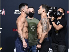LAS VEGAS, NEVADA - AUGUST 21:  In this handout image provided by UFC,   (L-R) Opponents Pedro Munhoz of Brazil and Frankie Edgar face off during the UFC Fight Night weigh-in at UFC APEX on August 21, 2020 in Las Vegas, Nevada.