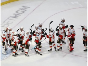 EDMONTON, ALBERTA - AUGUST 06:  The Calgary Flames celebrate their 3-0 victory against the Winnipeg Jets to win Game Four of the Western Conference Qualification Round prior to the 2020 NHL Stanley Cup Playoffs at Rogers Place on August 06, 2020 in Edmonton, Alberta.
