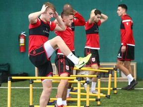 Cavalry FC players, including Elliott Simmons (left) exercise during training camp for the CPL team at the Macron Performance Centre in Calgary on March 2, 2020. Jim Wells/Postmedia