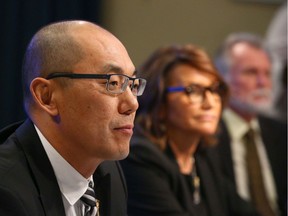 (L-R) Jason Luan, Associate Minister of Mental Health and Addictions, Geri Bemister-Williams, vice-chair, Supervised Consumption Services Review Committee and Rod Knecht, chair, Supervised Consumption Services Review Committee listen to a question as the Government of Alberta released a report on safe consumption sites in Alberta during a press conference in Calgary on Thursday, March 5, 2020.