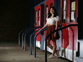 Sir Winston Churchill High School student Michelle Xu has launched an online petition to make this year's diploma exams optional due to the COVID-19 pandemic. She was photographed by the school's main doors on Saturday, August 1, 2020.