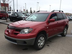Calgary police say a woman driving a red Mitsubishi Outlander similar to the one pictured here was carjacked on 16 Street N.W. around 1 p.m. Wednesday, Aug 5, 2020.