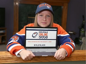 Edmonton Oilers fan Alexa-Rae Connelly poses in her Calgary home wearing a Jordan Eberle jersey on Saturday, August 8, 2020. Connelly recently tried to purchase $100 of online 50/50 tickets, but ended up buying $600 because of a website error.