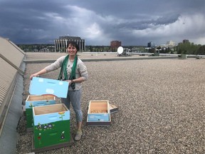 Arielle Zwiers of Honey Meadows Farm on the roof of Southcentre Mall. Southcentre is celebrating its third year of a beekeeping project with a honey donation.