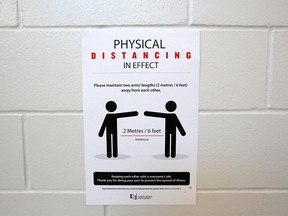 COVID-19 prevention signs are seen inside St. Marguerite School in New Brighton on Aug. 25, 2020. A few days later the province quietly dropped the physical distancing requirement.