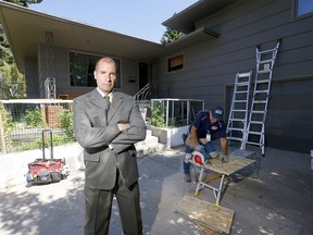 Mike Letourneau, Justice and Solicitor General for the SCAN unit, Alberta Sheriff, shuts down a drug house at 204 Cardiff Dr. N.W. in Calgary after a year long investigation of complaints on drugs, weapons and fire arms being fired off at the home on Tuesday, August 4, 2020.