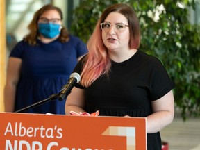 Teacher Kendra Mills speaks during a news conference by NDP Opposition education critic Sarah Hoffman at the Federal Building, on Aug. 17, 2020.