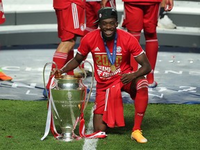 Bayern Munich's Alphonso Davies poses with the Campions League trophy in Lisbon, Portugal, on Aug. 23, 2020. Born to Liberian parents in Ghana, Davies came to Edmonton at five years old.
