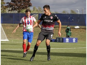 Canadian Premier League - Atletico Ottawa vs Cavalry FC - Charlottetown, PEI- Aug 27, 2020]. Cavalry FC #4 Dominick Zator takes posession of the ball.