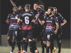 Cavalry FC celebrate thier first half goal by Dominick Zator (centre-facing camera) against Forge FC on Thursday, August 13, 2020 during the opening game of the Canadian Premier League Island Games soccer action in Charlottetown, Prince Edward Island. The game ended in a 2-2 draw. The Island Games commence August 13 and finish in mid-September. Canadian Premier League/Chant Photography