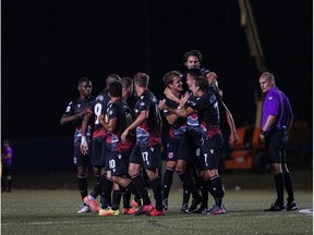 CP-Web.  Canadian Premier League - Forge FC vs Cavalry FC- Charlottetown, PEI - [Aug, 13, 2020]. [Cavalry FC celebrates after the first goal by #4 Dominick Zator ].