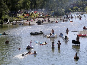 Calgarians beat the heat on the Elbow River at Stanley Park on Sunday, Aug. 16, 2020.