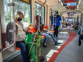 Passengers on a Calgary CTrain on July 22, 2020. It is now mandatory to wear a mask CTrains and buses.