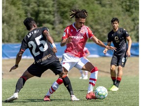 Cavalry FC Mohamed Farsi takes on Valour FC Solomon Antwi on Sunday, August 16, 2020, during Canadian Premier League Island Games in Charlottetown, Prince Edward Island. Cavalry won 2-0 and Farsi was named Man of the Match. CPL/Chant Photography