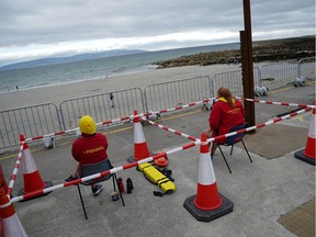 Lifeguards sit within protective socially distant barriers at Silverstrand beach amid the coronavirus disease (COVID-19) outbreak in Galway, Ireland, July 23, 2020.