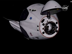 In this image provided by NASA, the SpaceX Dragon crew capsule, with NASA astronauts Doug Hurley and Robert Behnken aboard, docks with the International Space Station Sunday, May 31, 2020. It was the first time a privately built and owned spacecraft carried astronauts to the orbiting lab in its nearly 20 years.
