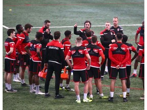 Cavalry FC coaching staff Tommy Wheeldon Jr, Martin Nash and Jordan Santiago gathers players and training staff during training camp at Macron Performance Centre in Calgary on Monday, March 2, 2020. Jim Wells/Postmedia