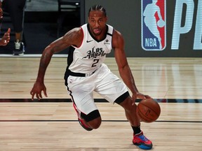 Kawhi Leonard #2 of the LA Clippers controls the ball against the Denver Nuggets on August 12, 2020 in Lake Buena Vista, Florida.