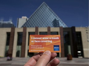 City of Edmonton face mask exemption card is photographed outside Edmonton City Hall, in Monday Aug. 10, 2020. A City of Edmonton bylaw requiring people to wear face masks in all public indoor spaces went into effect Aug. 1, 2020. However the City has begun issuing face mask exemption cards at Edmonton recreation centres. Photo by David Bloom