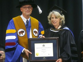 Mount Royal University president Tim Rahilly and Dawn Farrell, MRU chancellor and CEO of TransAlta Corp., says the challenges of 2020 only reinforce the importance of a post-secondary education. In this file photo, Farrell is receiving her honorary doctor of laws degree on June 5, 2019.