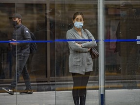 A passenger waits for the train wearing a face mask at City Hall station on Tuesday, September 15, 2020.