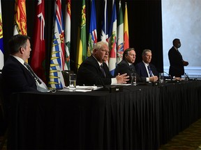 Ontario Premier Doug Ford, second left, speaks as Alberta Premier Jason Kenney, Quebec Premier Francois Legault and Manitoba Premier Brian Pallister look on during a press conference in Ottawa on Friday, Sept. 18, 2020.