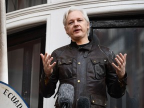 In this file photo taken on May 19, 2017 Wikileaks founder Julian Assange speaks on the balcony of the Embassy of Ecuador in London.