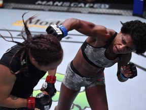 Angela Hill punches Michelle Waterson in a strawweight fight during the UFC Fight Night event at UFC APEX on Sept. 12, 2020 in Las Vegas. Jeff Bottari/Zuffa LLC via Getty Images