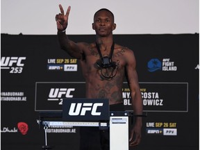 ABU DHABI, UNITED ARAB EMIRATES - SEPTEMBER 25: In this handout image provided by UFC,Israel Adesanya of Nigeria poses on the scale during the UFC 253 weigh-in on September 25, 2020 at Flash Forum on UFC Fight Island, Abu Dhabi, United Arab Emirates.